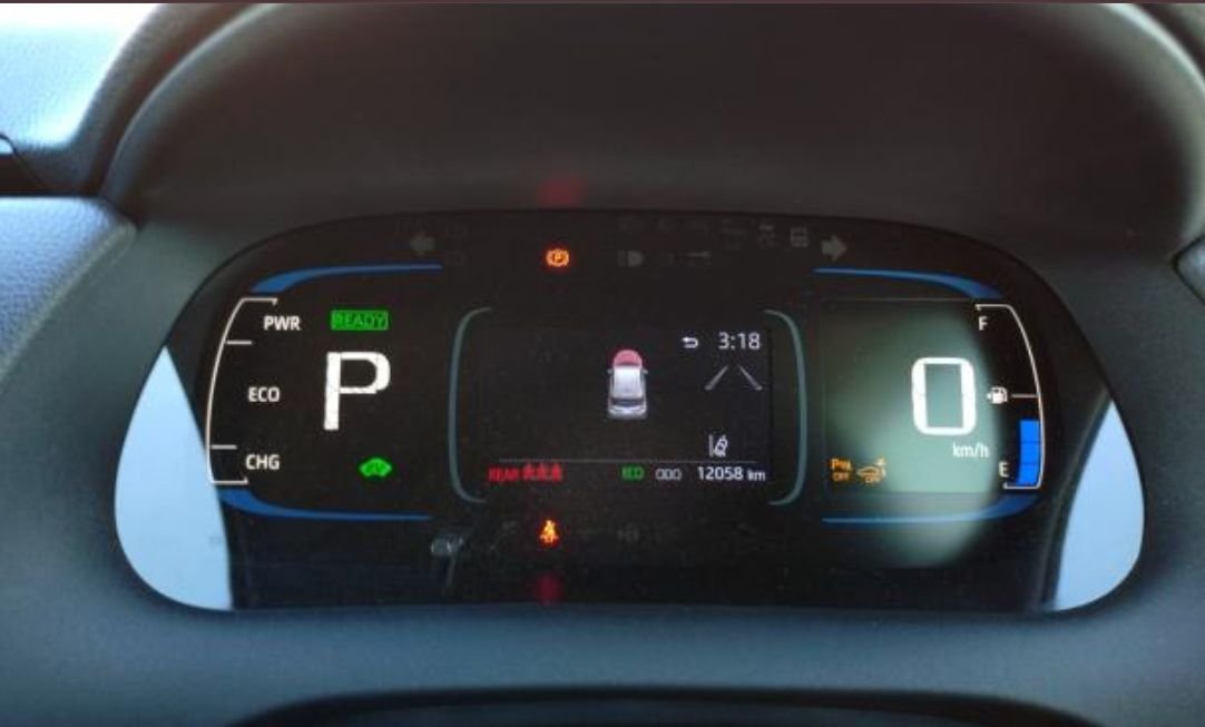 Instrument cluster showing 12,058 km