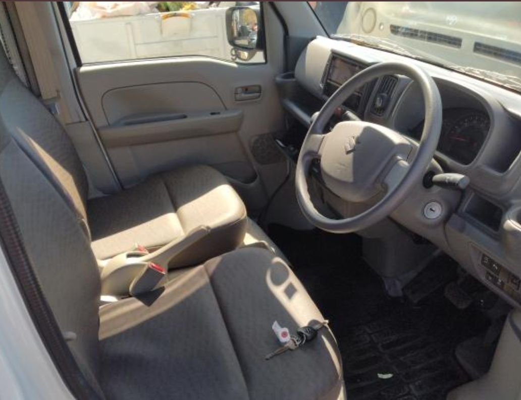 Right-hand-drive interior with grey cloth seats