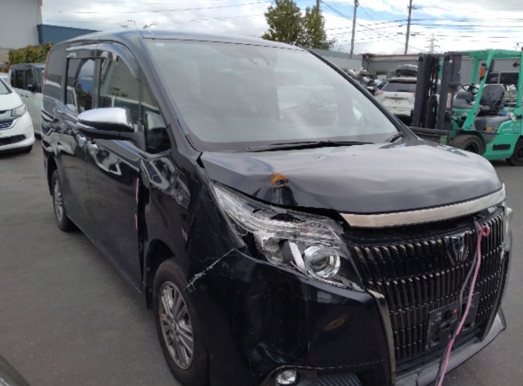 Front right of the Toyota Esquire showing front-end damage