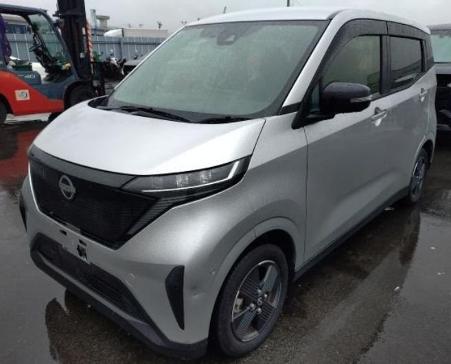 Silver Nissan Sakura electric kei car seen from the front left
