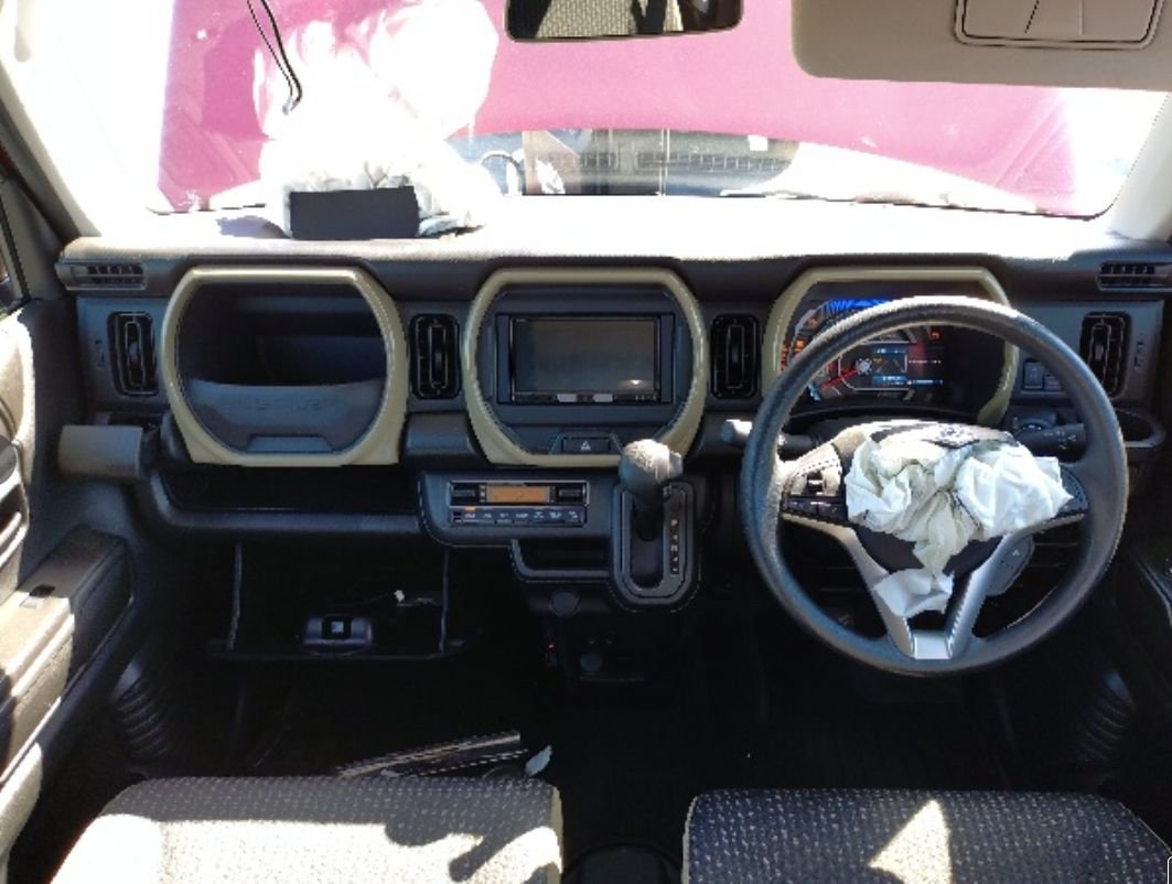 Right-hand-drive dashboard with deployed airbags