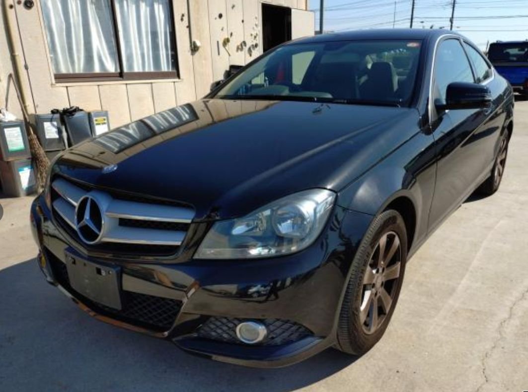 Black Mercedes-Benz C180 Coupe seen from the front left