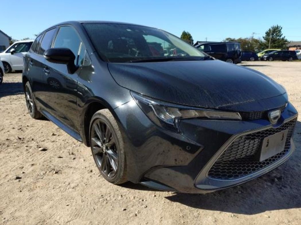 Black Toyota Corolla Touring wagon seen from the front right