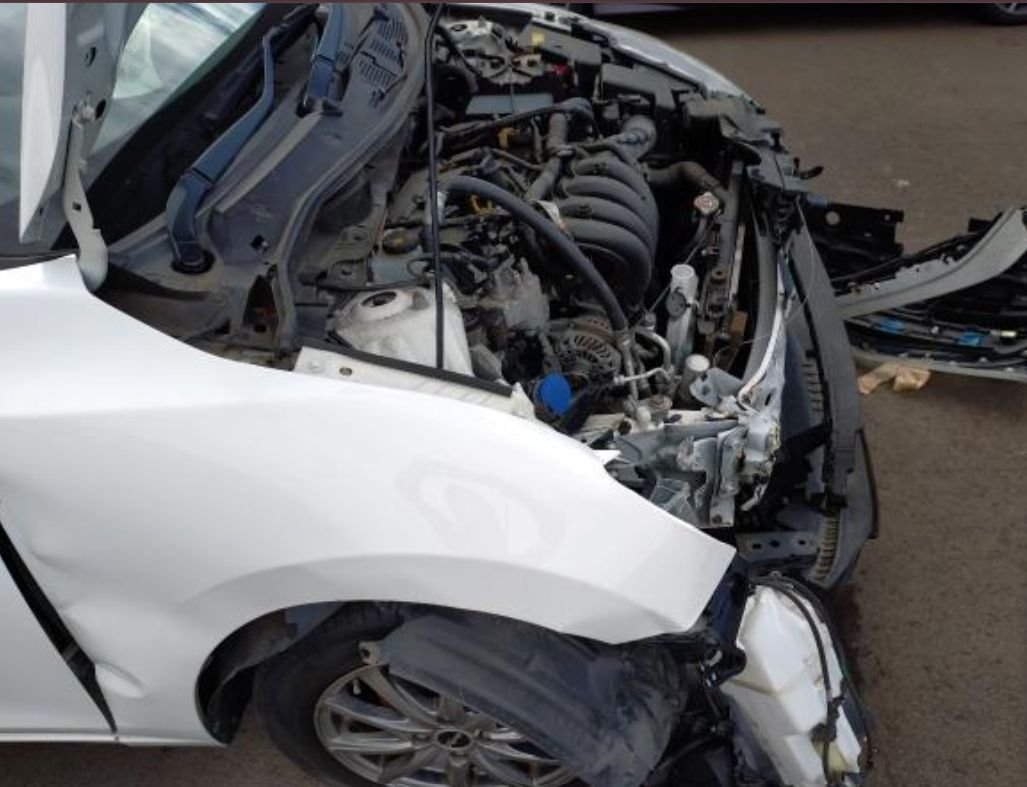 Damaged front-right corner with the engine bay exposed