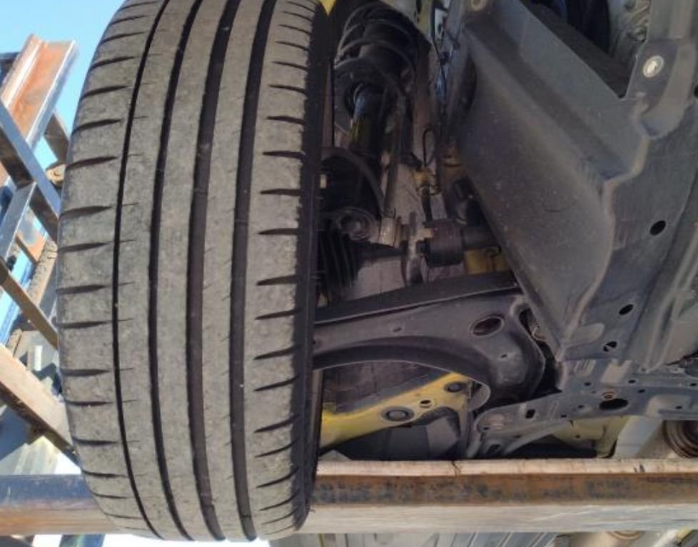 Front suspension and tyre seen from underneath