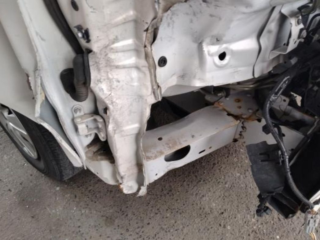 Close-up of the crushed front corner and pillar