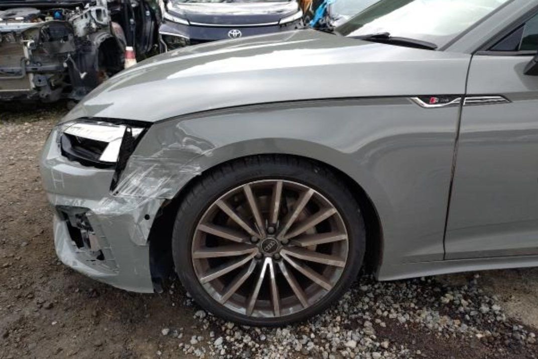 Left front wing creased behind the headlight