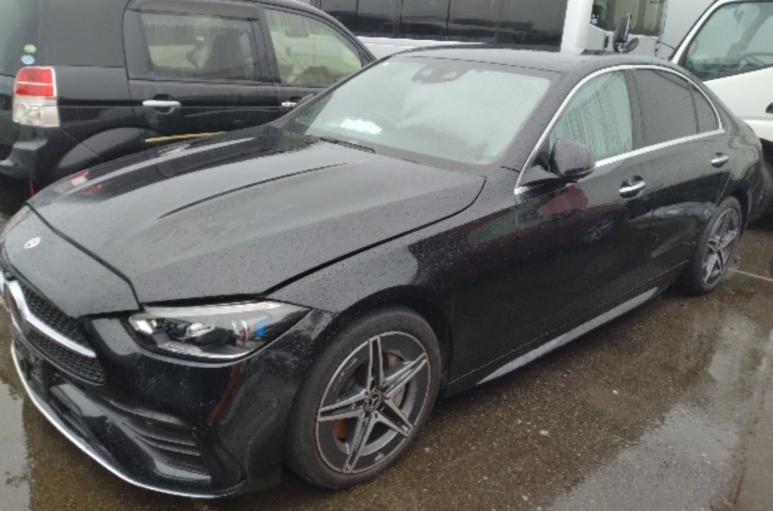 Black Mercedes-Benz C220d seen from the front left
