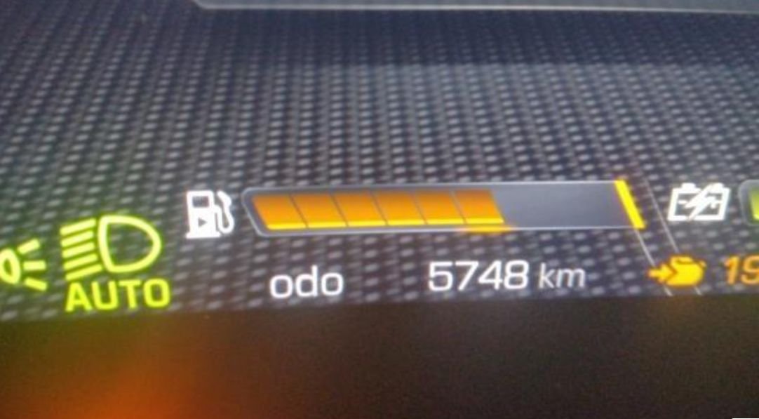 Instrument cluster showing 5,748 km