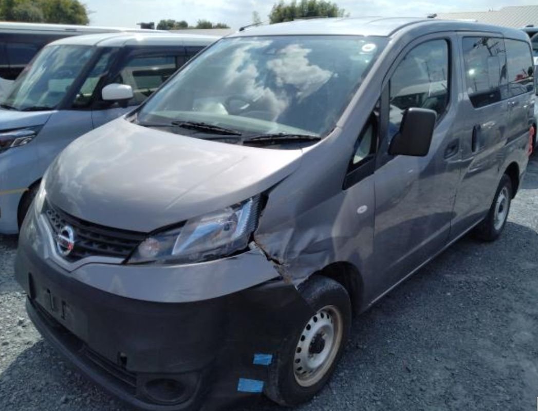 Grey Nissan NV200 van seen from the front left with front-left damage