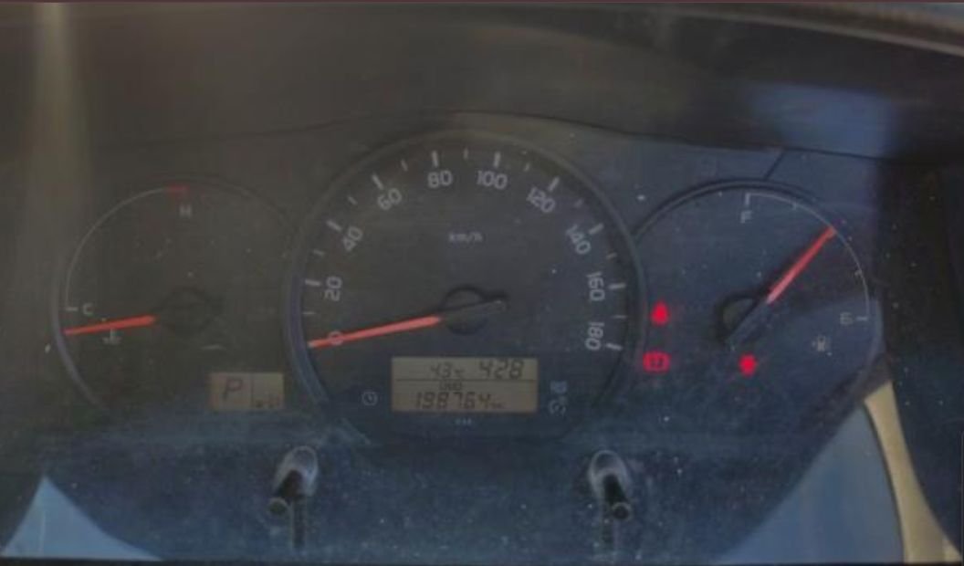 Instrument cluster showing 198,764 km