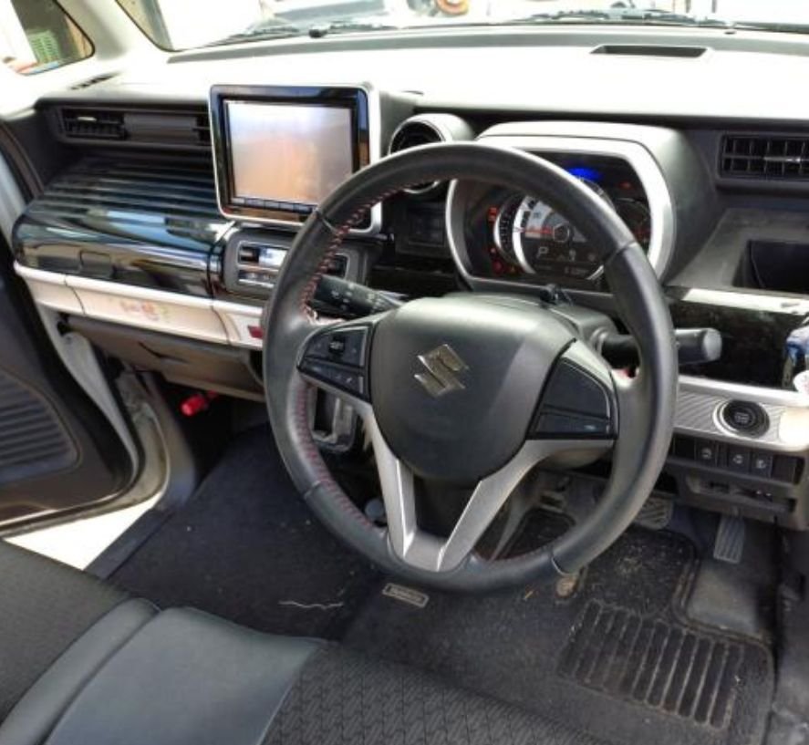 Right-hand-drive dashboard with navigation screen