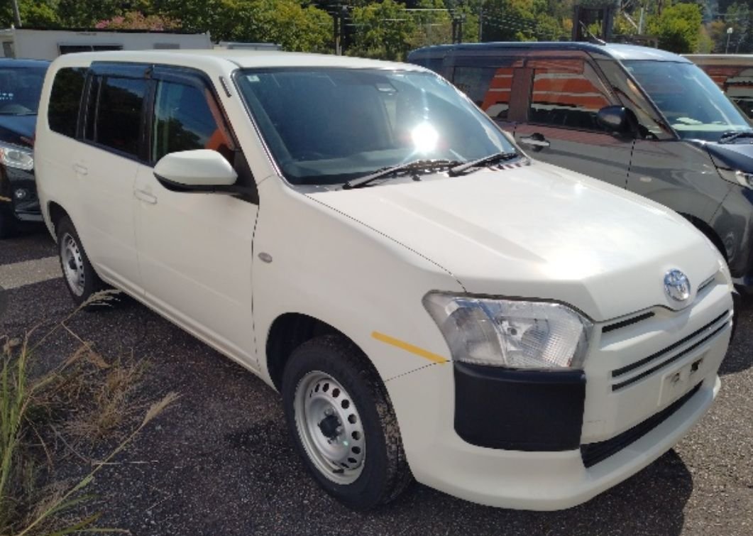 White Toyota Probox van seen from the front right
