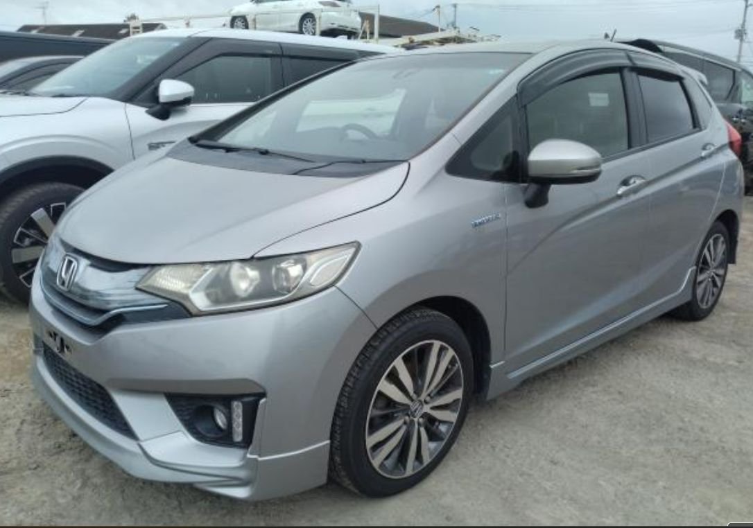 Silver Honda Fit Hybrid seen from the front left