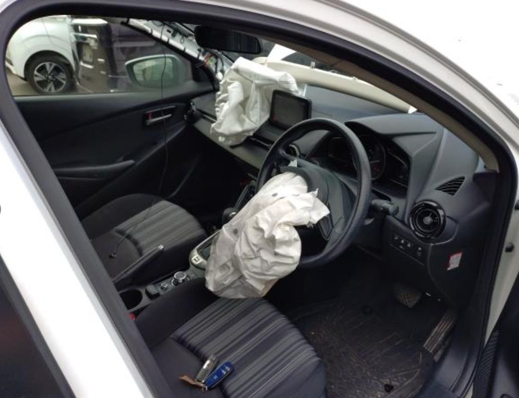 Right-hand-drive interior with deployed airbags
